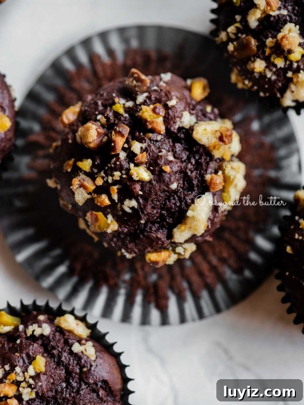 Cream Cheese Swirled Chocolate Chip Brownies 21 Dark chocolate pistachio cream cheese muffins with one unwrapped muffin.