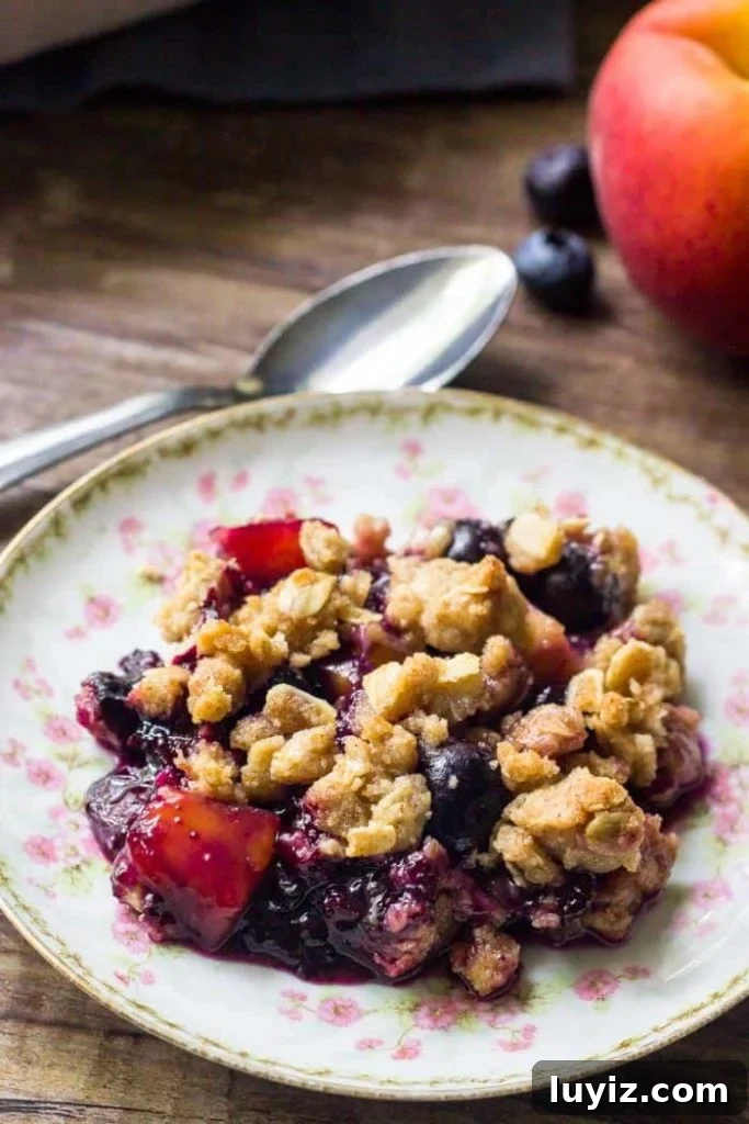 Blueberry Peach Crumble Recipe with Brown Sugar Oat Topping 2 This blueberry peach crumble is filled with delicious summer fruit with delicious crumble topping.