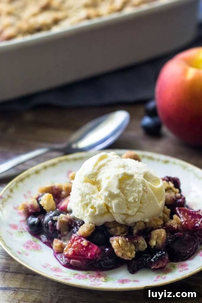 Blueberry Peach Crumble Recipe with Brown Sugar Oat Topping 3 A serving of blueberry peach crumble with streusel topping makes for the perfect summer dessert.