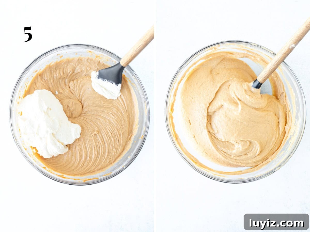 No-Bake Pumpkin Cheesecake Recipe: Creamy Fall Dessert in Minutes 7 Folding whipped cream into no bake pumpkin cheesecake filling.