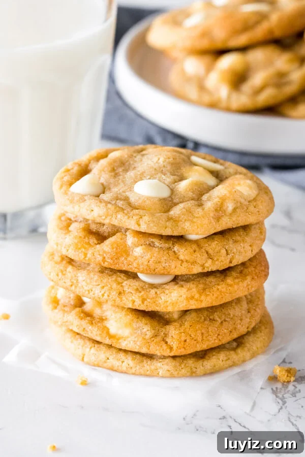 Chewy White Chocolate Chip Cookie Recipe You’ll Love 3 A stack of white chocolate chip cookies.