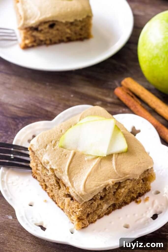 Caramel Frosted Apple Cake with Cinnamon Crumble 2 Apple cake with caramel frosting is moist, filled with cinnamon & perfect for fall.