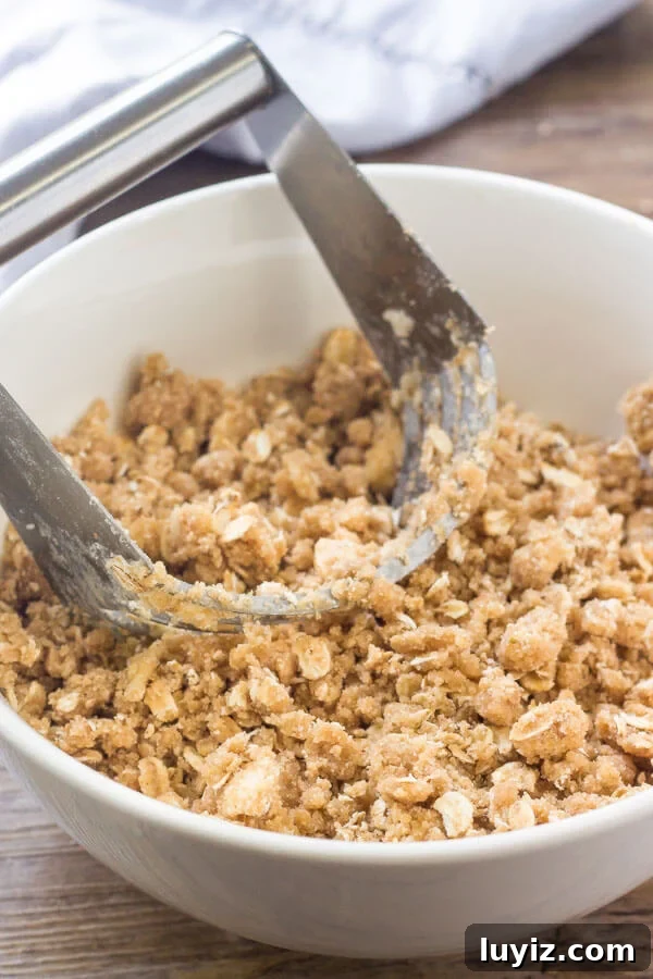 Classic Warm Apple Crisp Recipe for Fall Desserts 4 Crumble topping for a baked apple crisp made with butter, brown sugar, flour, cinnamon & oats.