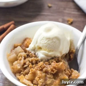 Warm apple crisp with cinnamon apples and oatmeal crumble topping makes for the perfect cozy dessert.