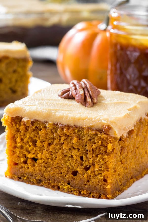 Pumpkin Cake with Caramel Cream Cheese Frosting Recipe 5 A slice of moist pumpkin cake with caramel cream cheese frosting is the perfect dessert for fall or Thanksgiving.