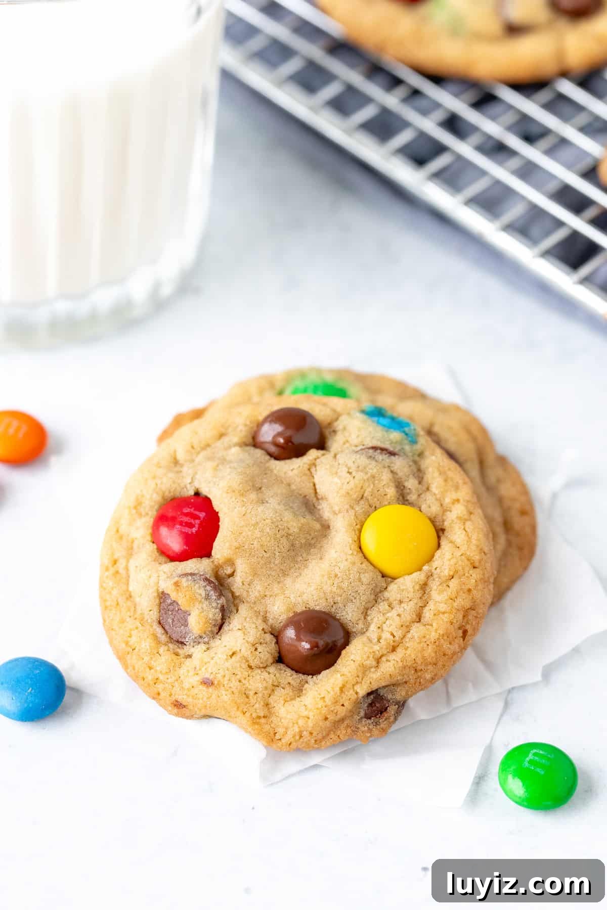 Soft & Chewy M&M Cookies That Melt in Your Mouth 2 2 M&M cookies with glass of milk