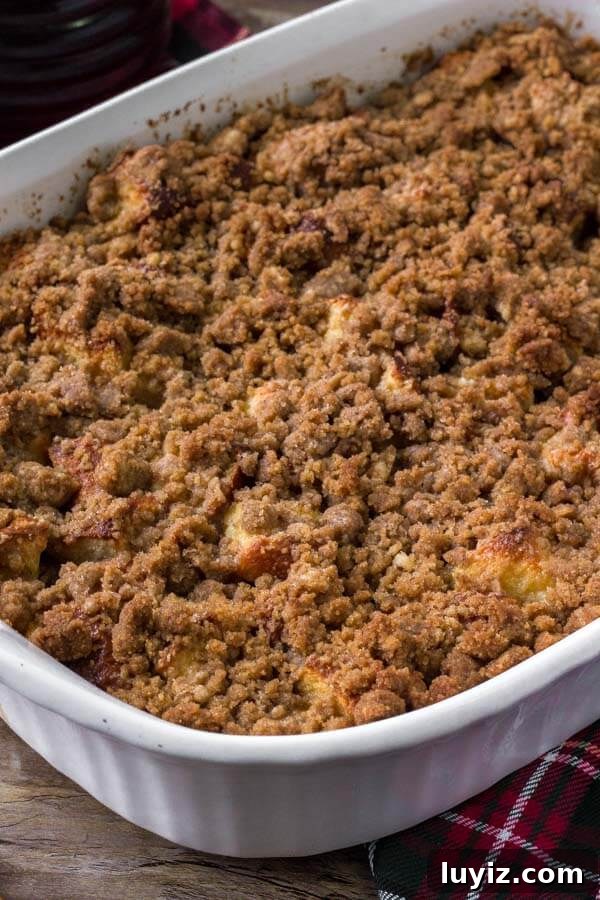 Casserole dish of eggnog french toast bake. Make it ahead for the perfect, easy Christmas breakfast. 