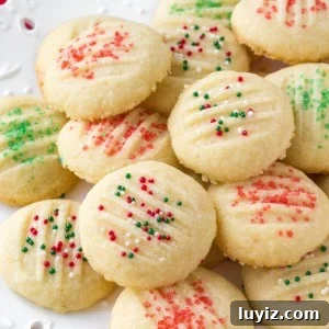 Whipped shortbread cookies are light as air with a delicious buttery flavor. They melt in your mouth because they're so soft, and only require a few simple ingredients.