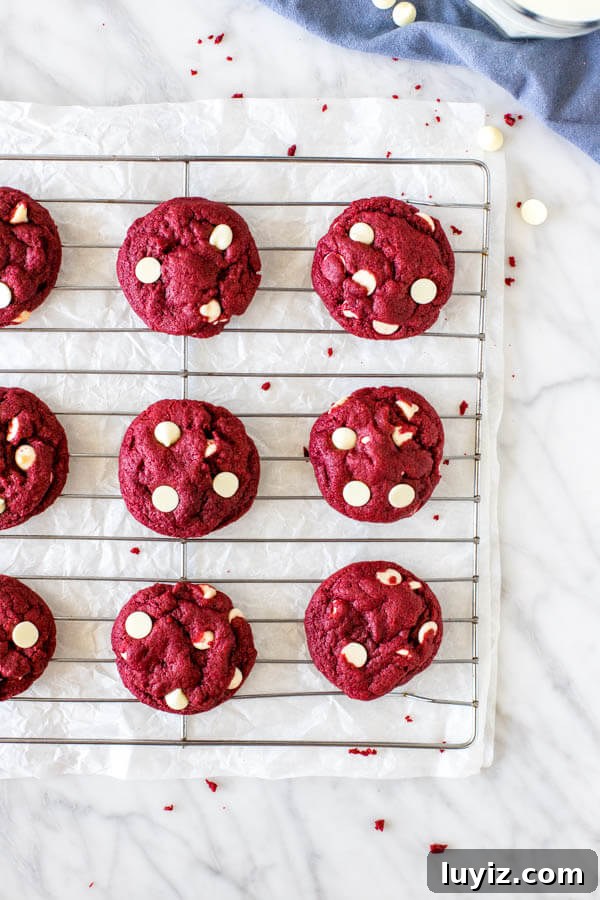 Red Velvet Cake Mix Cookies Recipe — Soft, Chewy Treats 4 Cooling rack of red velvet white chocolate chip cookies