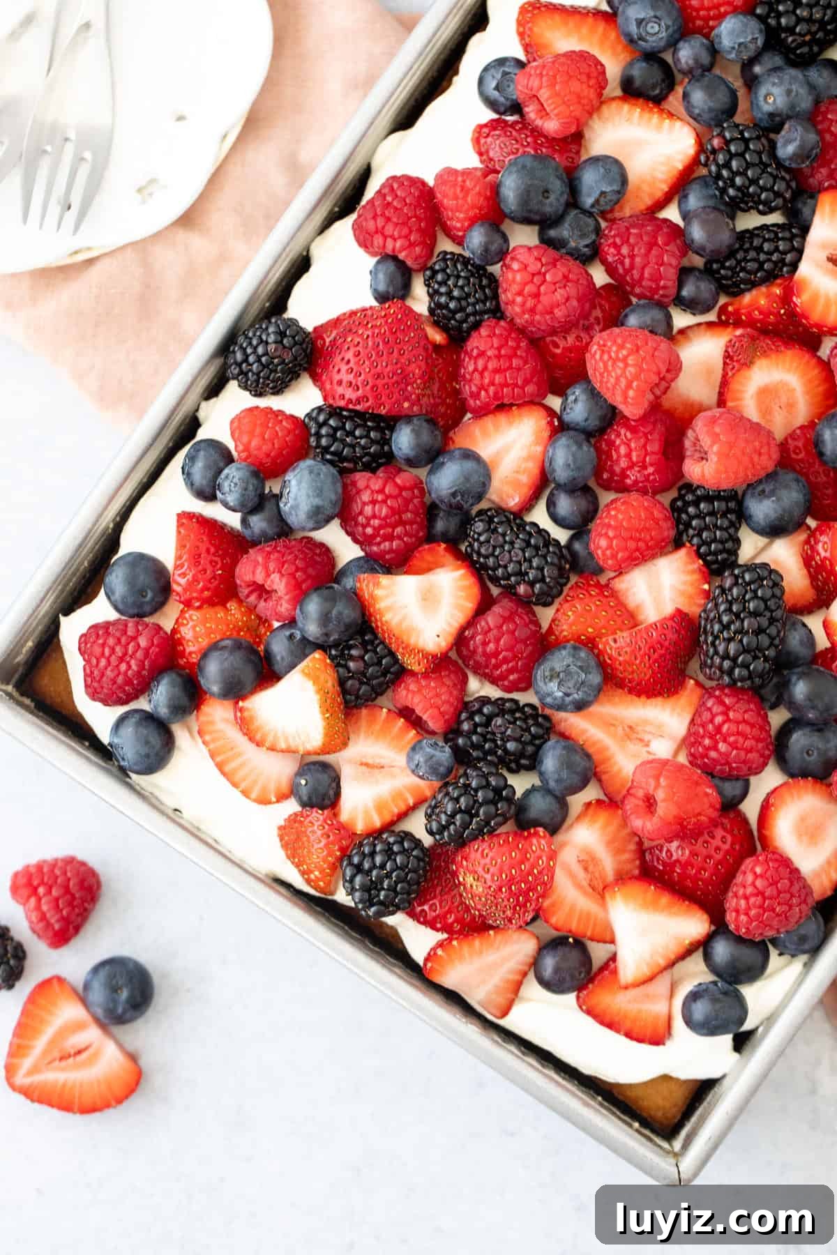 Berries & Cream Sheet Cake Recipe: Light, Fresh Dessert for Gatherings 3 9x13 inch pan of sheet cake topped with whipped cream topping and berries
