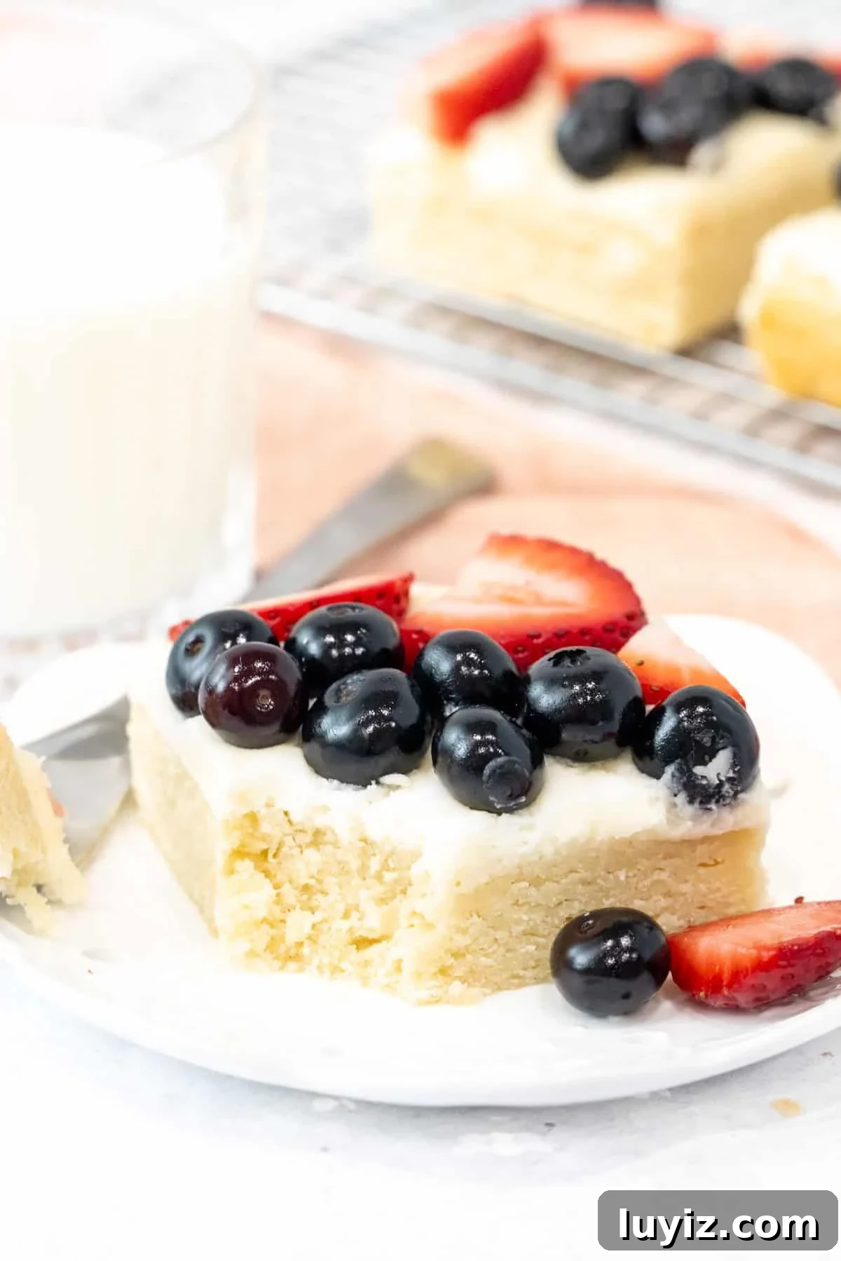 Berry-Topped Sugar Cookie Bars Recipe 4 Sugar cookie bar with vanilla frosting and berries on top
