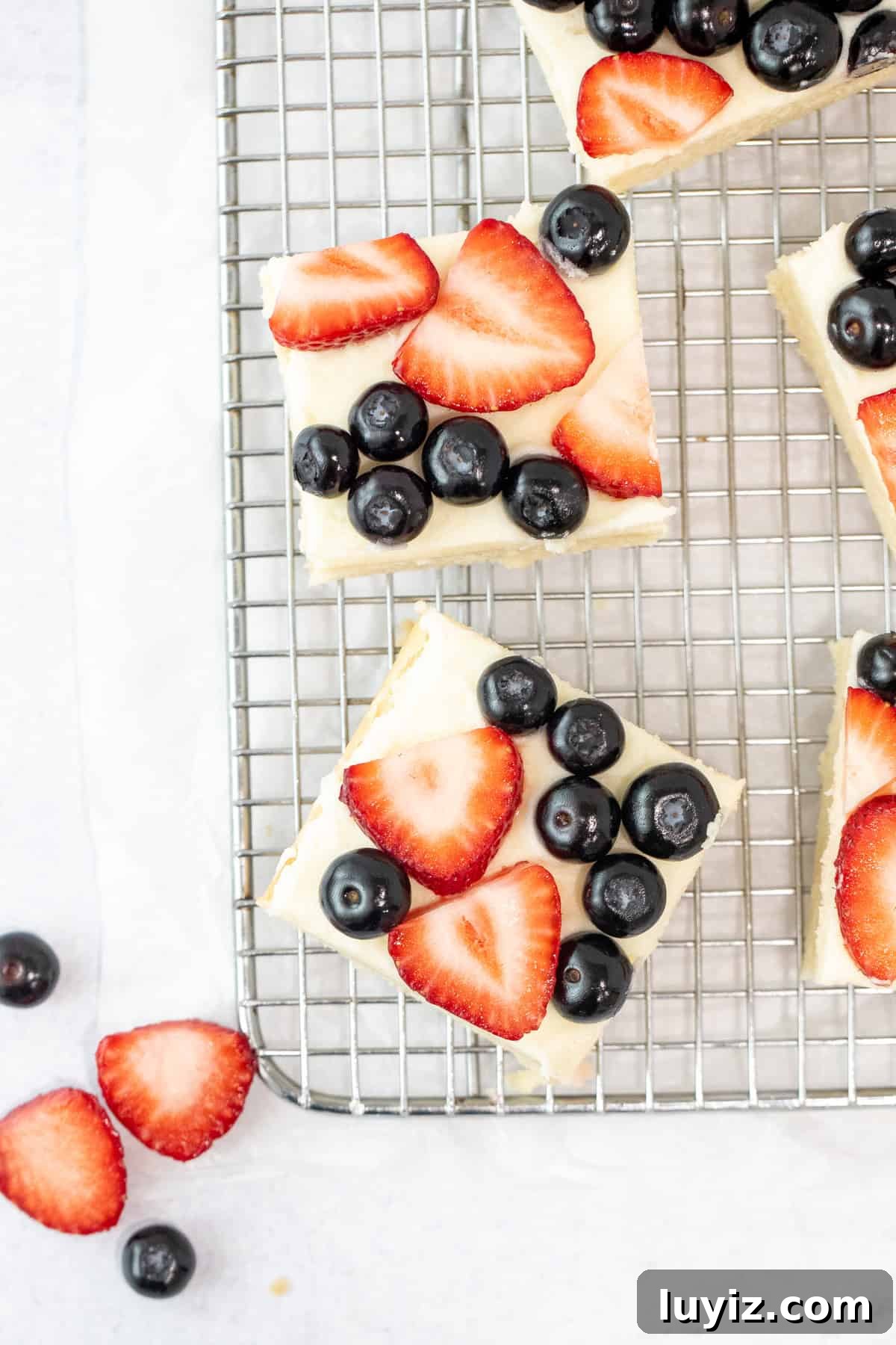 Berry-Topped Sugar Cookie Bars Recipe 5 berry sugar cookie bars on a cutting board