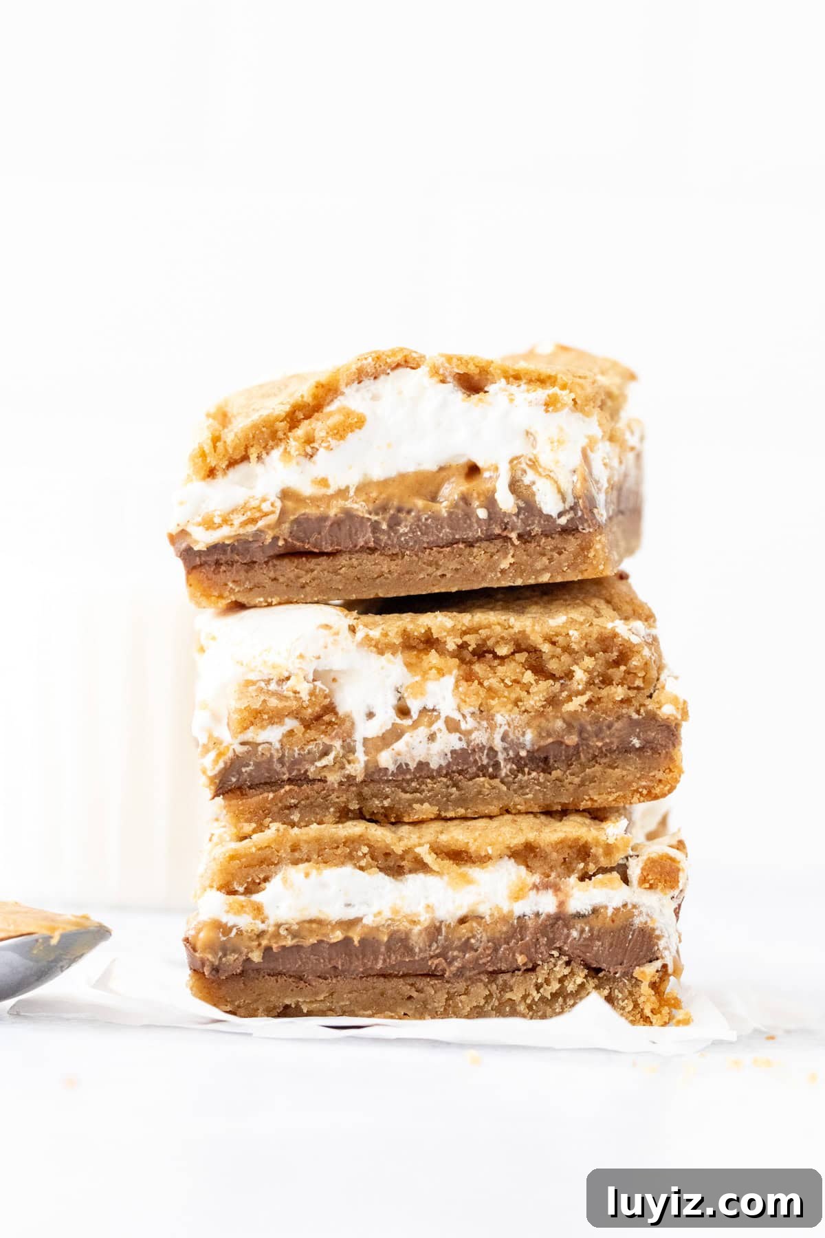 gooey peanut butter cookie s'mores  bars, stacked one on top of another