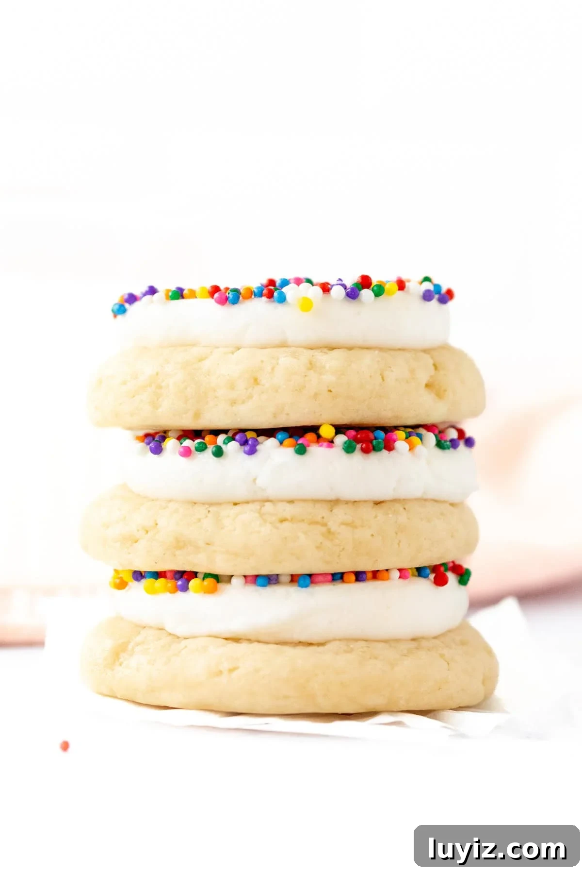 Three dot cake cookies, stacked on top of one another