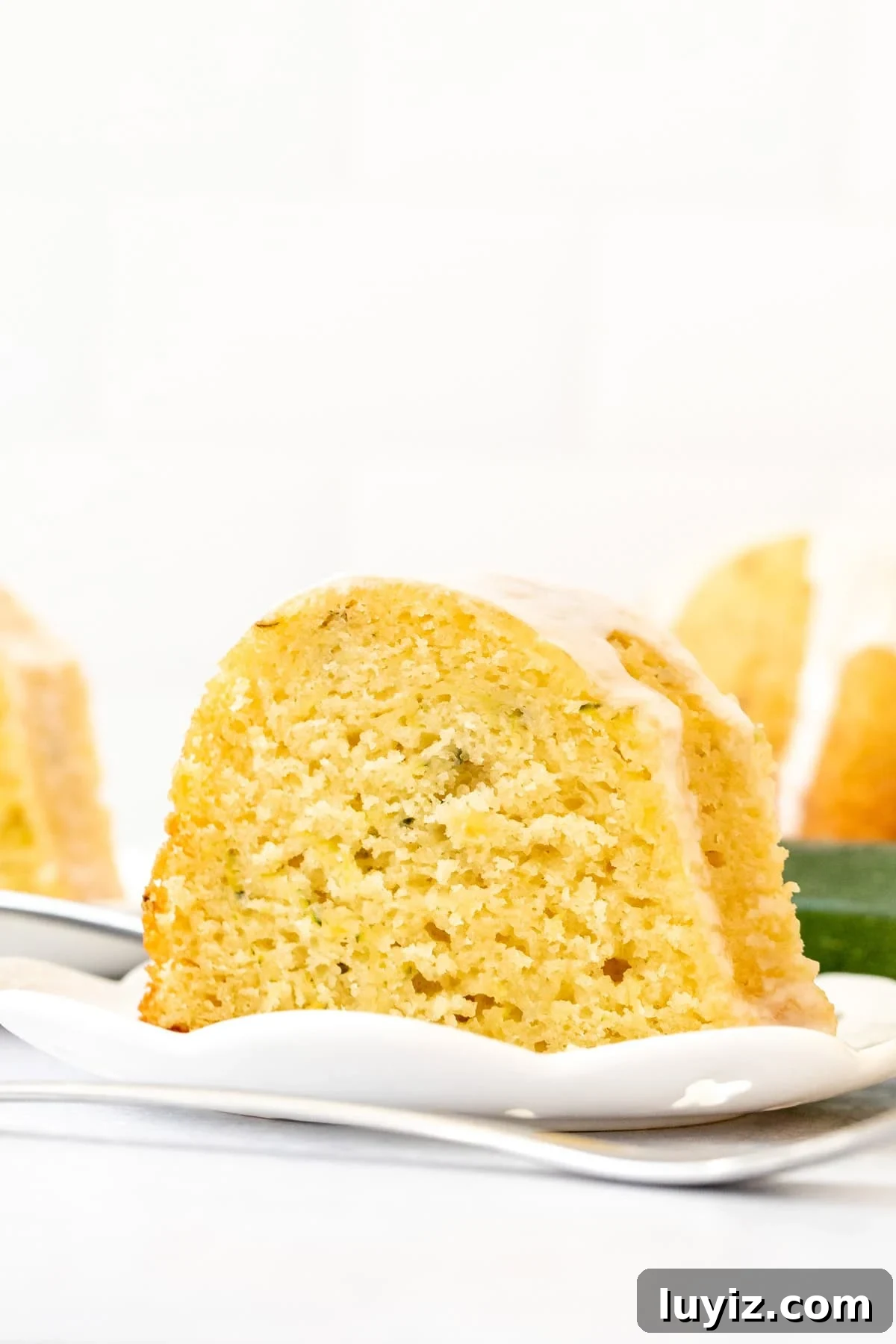 Moist Lemon Zucchini Cake with Lemon Glaze 2 Slice of lemon zucchini cake