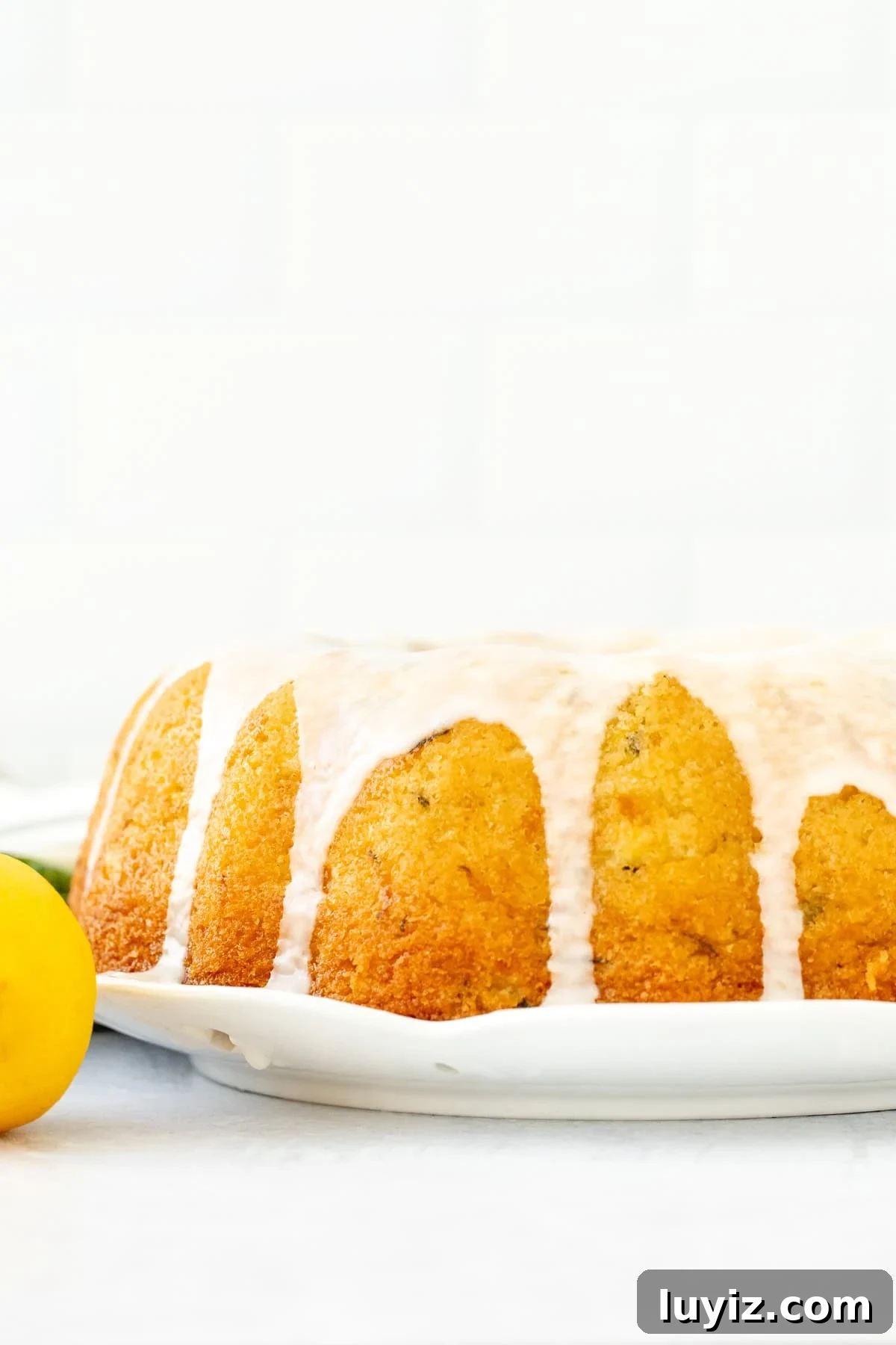 Moist Lemon Zucchini Cake with Lemon Glaze 3 lemon zucchini bundt cake topped with a drizzle of lemon glaze