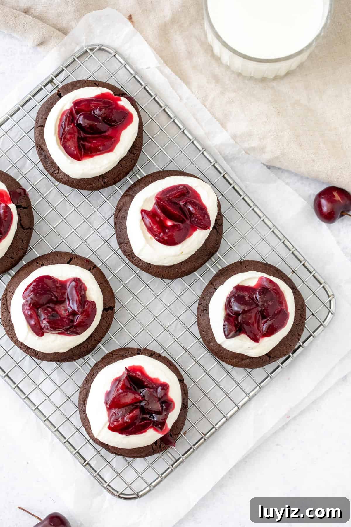 Black Forest Cherry Chocolate Cookies Recipe 3 Chocolate cookies topped with whipped cream and cherry sauce