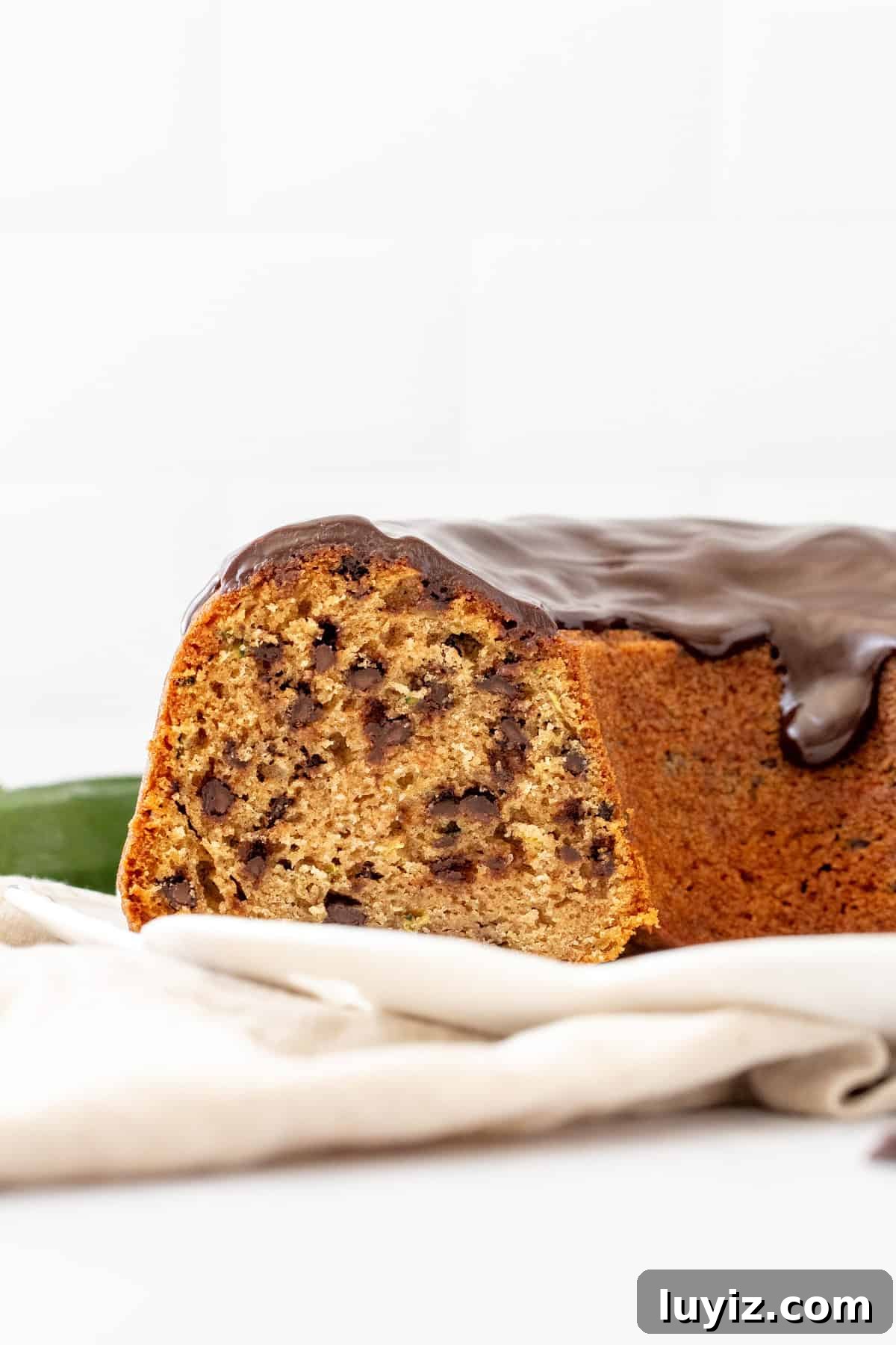 Moist Chocolate Chip Zucchini Cake Recipe 6 chocolate chip zucchini bundt cake with slices cut out of the cake