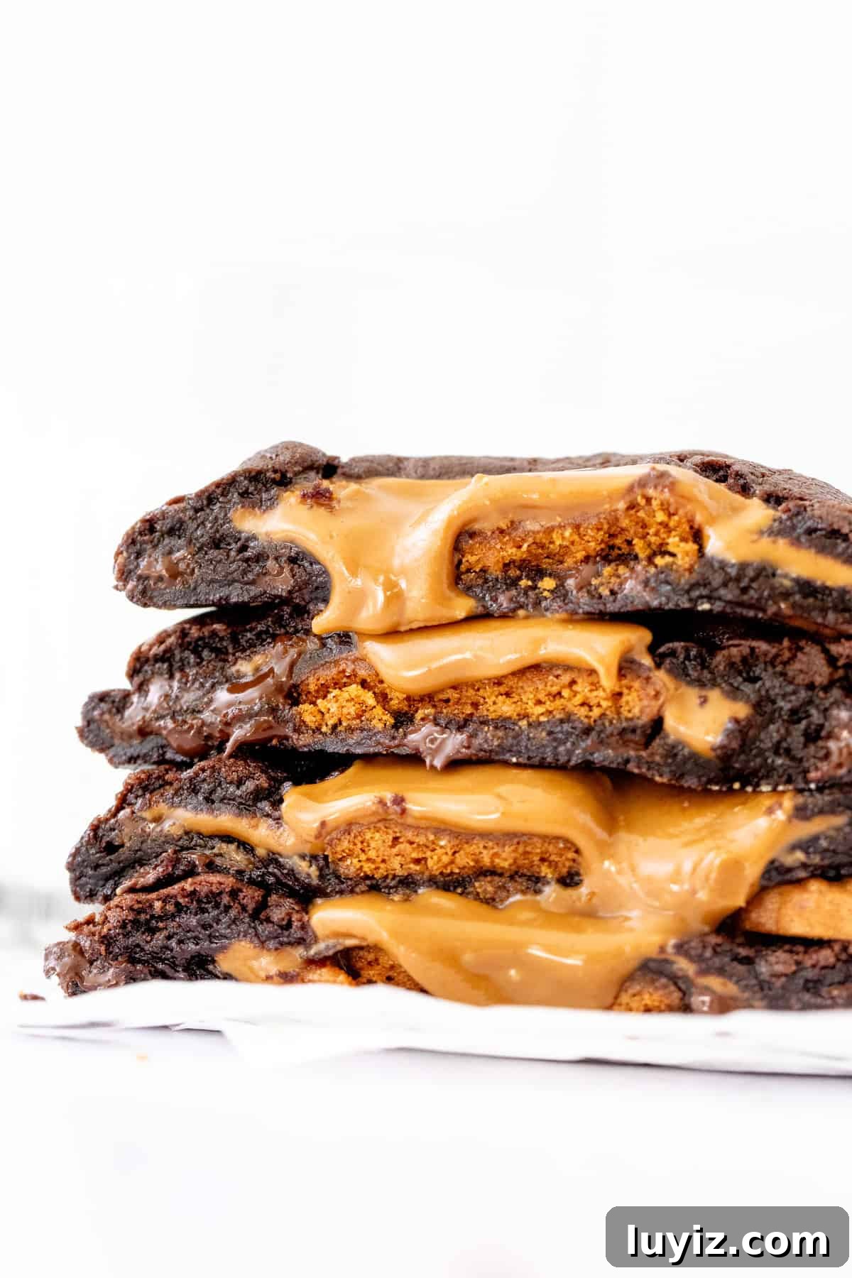 Stack of BIscoff stuffed chocolate cookies broken in half