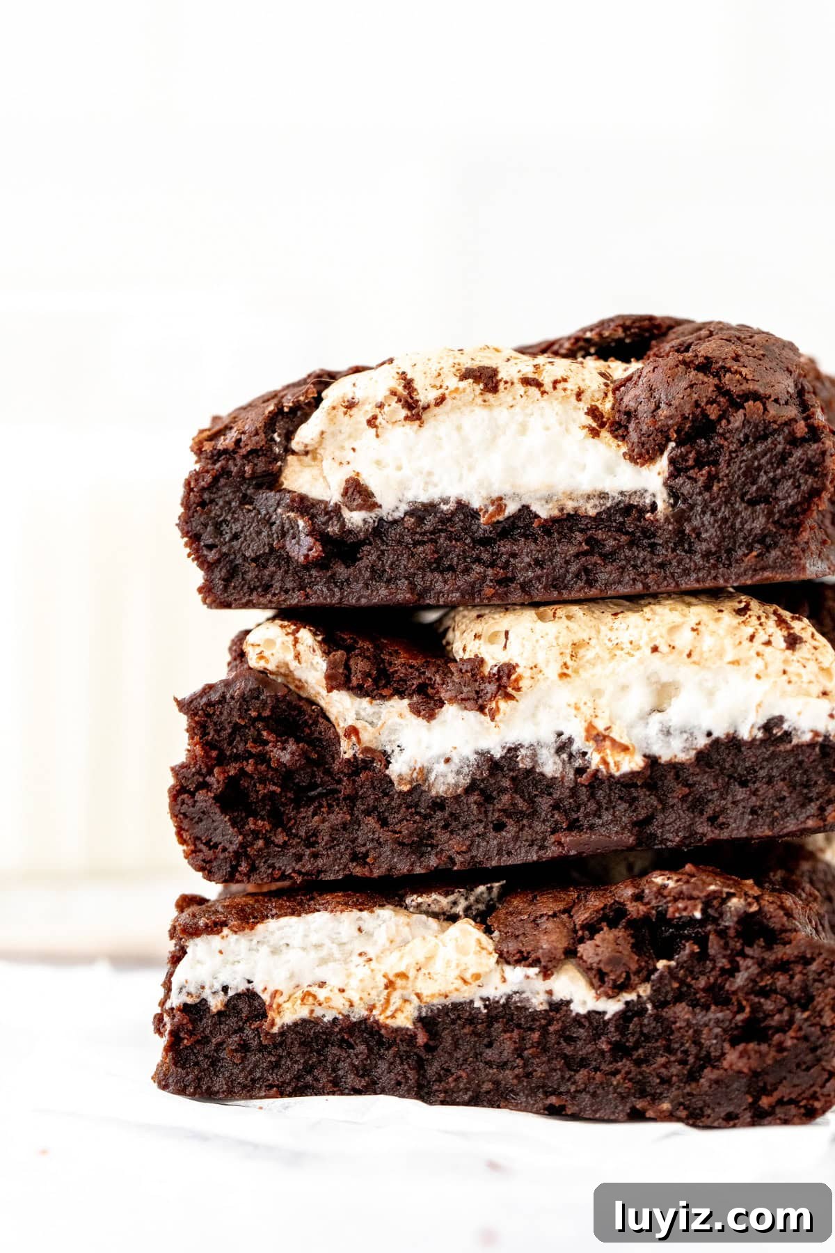 Stack of three brownies with dollops of marshmallow fluff
