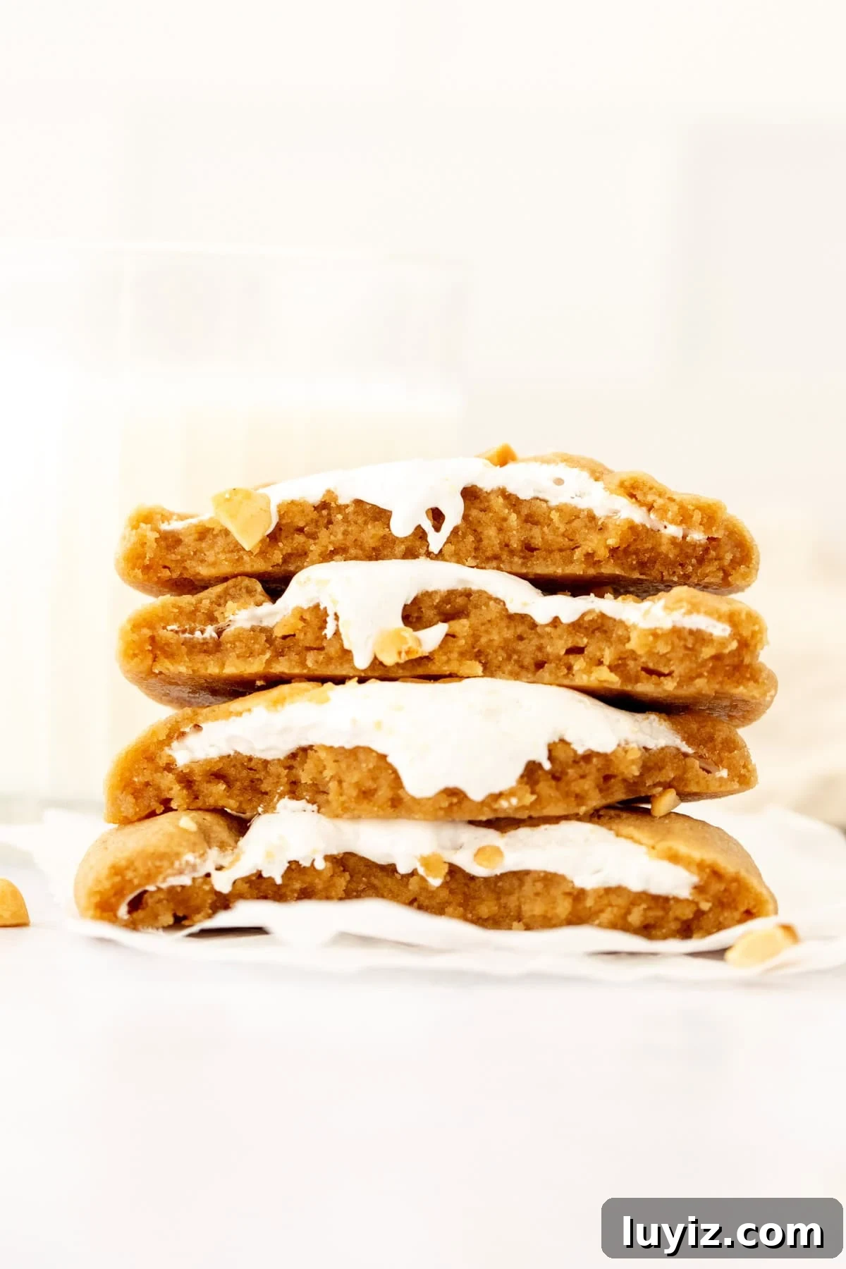 Stack of peanut butter marshmallow cookies broken in half