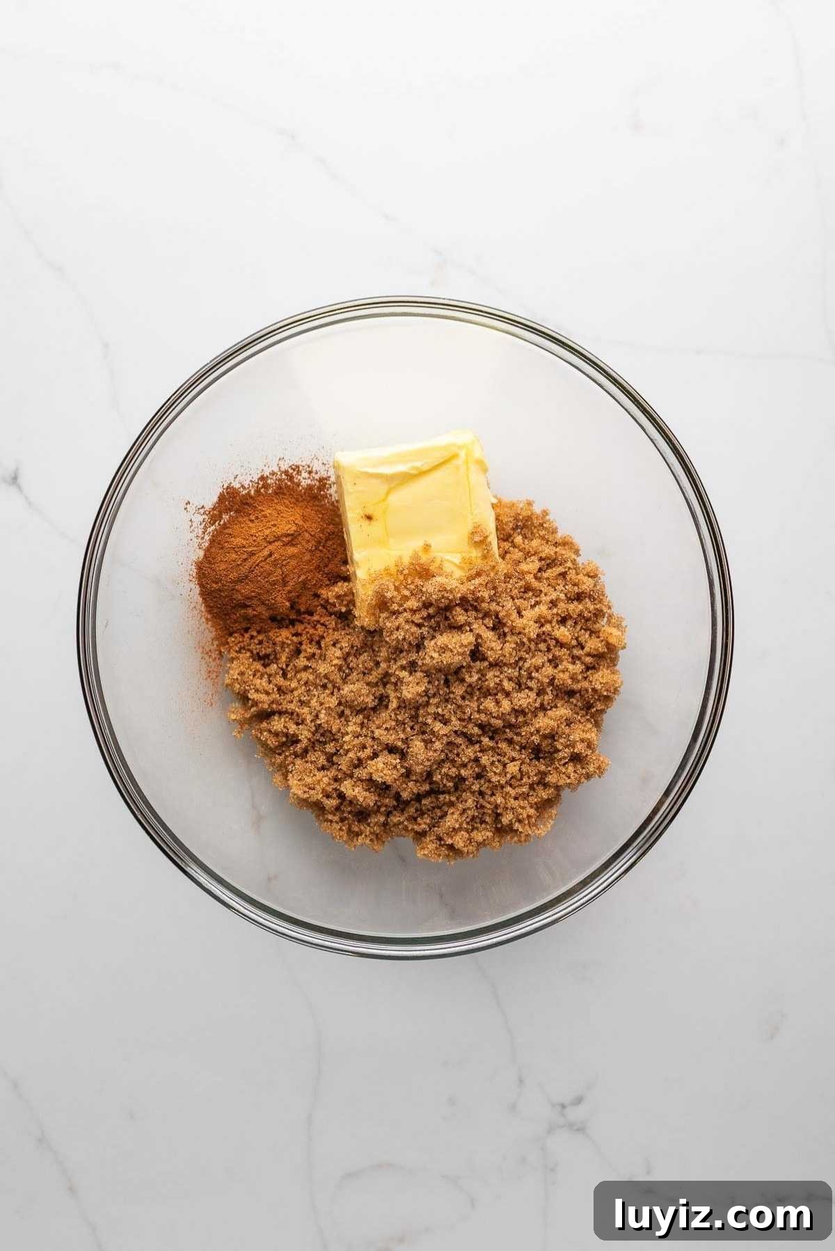 Brown sugar, butter, and cinnamon in a bowl.