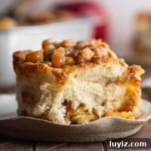 Apple streusel cinnamon roll on a plate.